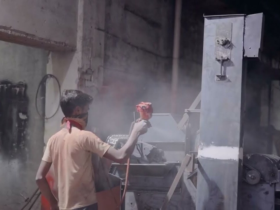 Finishing and painting a machine on the shop floor at Kamla Agro, Bareilly